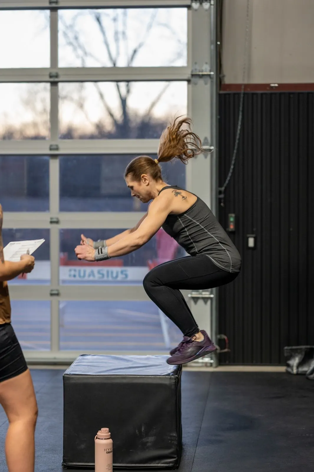 A member jumping onto a box while a judge counts