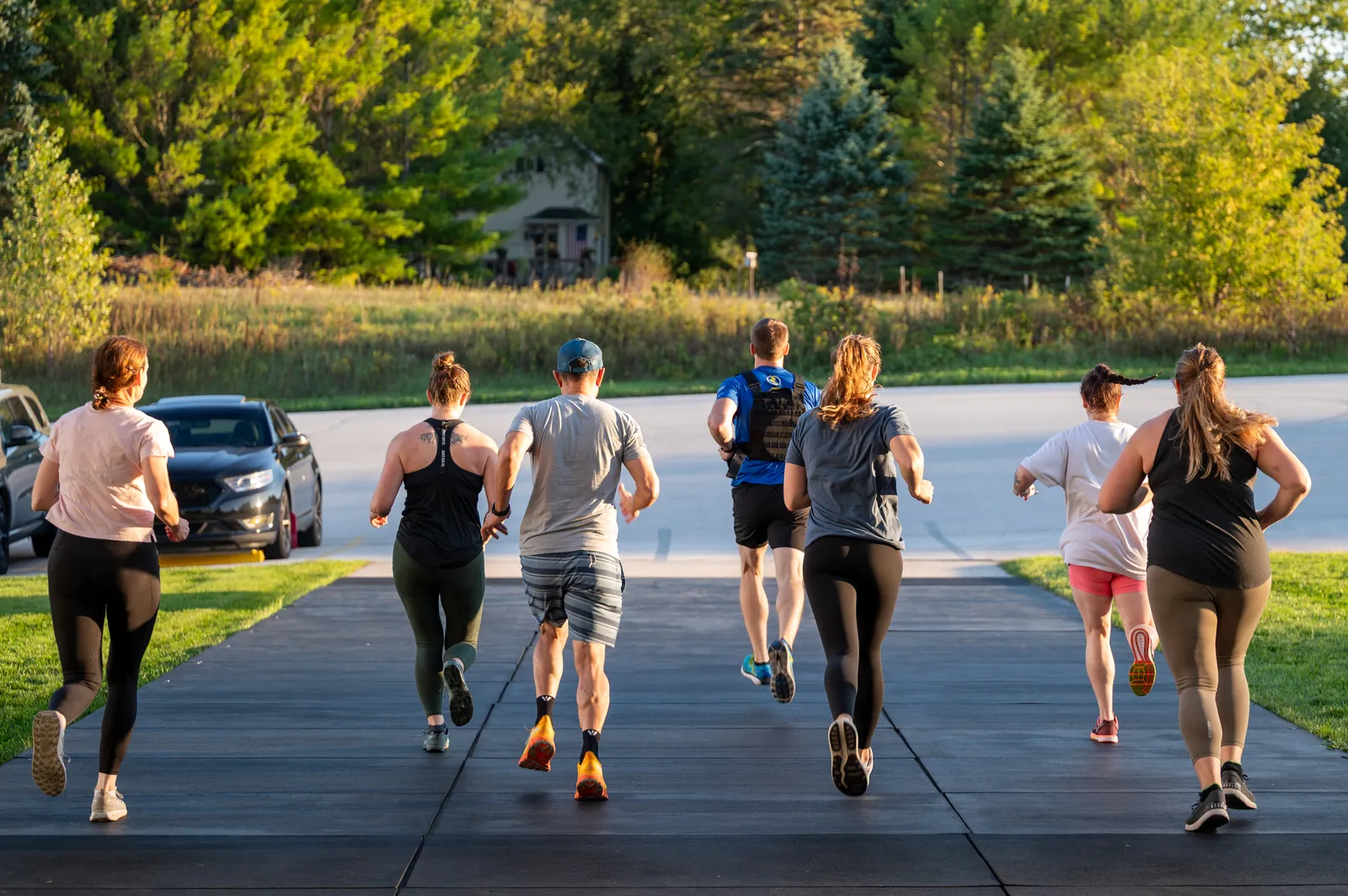 Members running together outside the gym