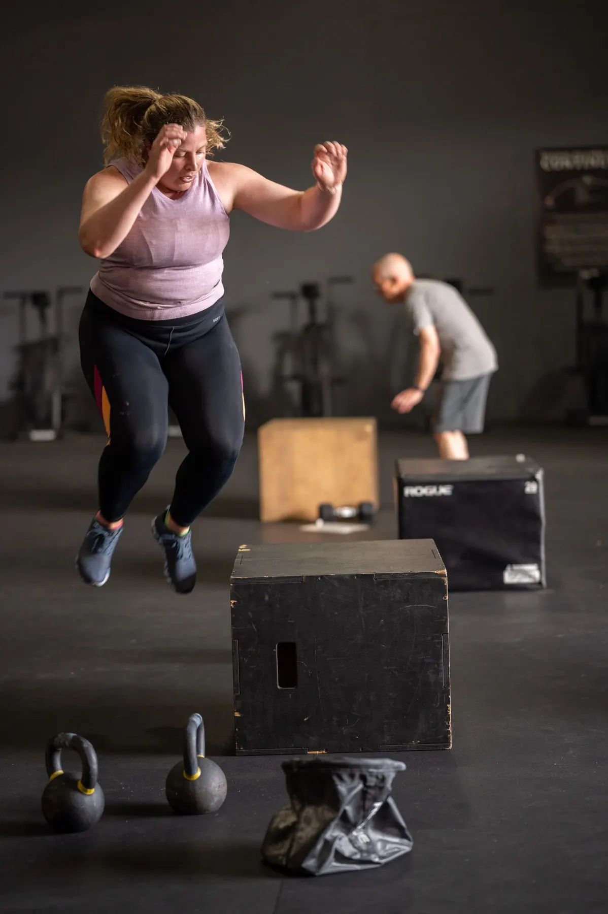 A member jumping onto a box