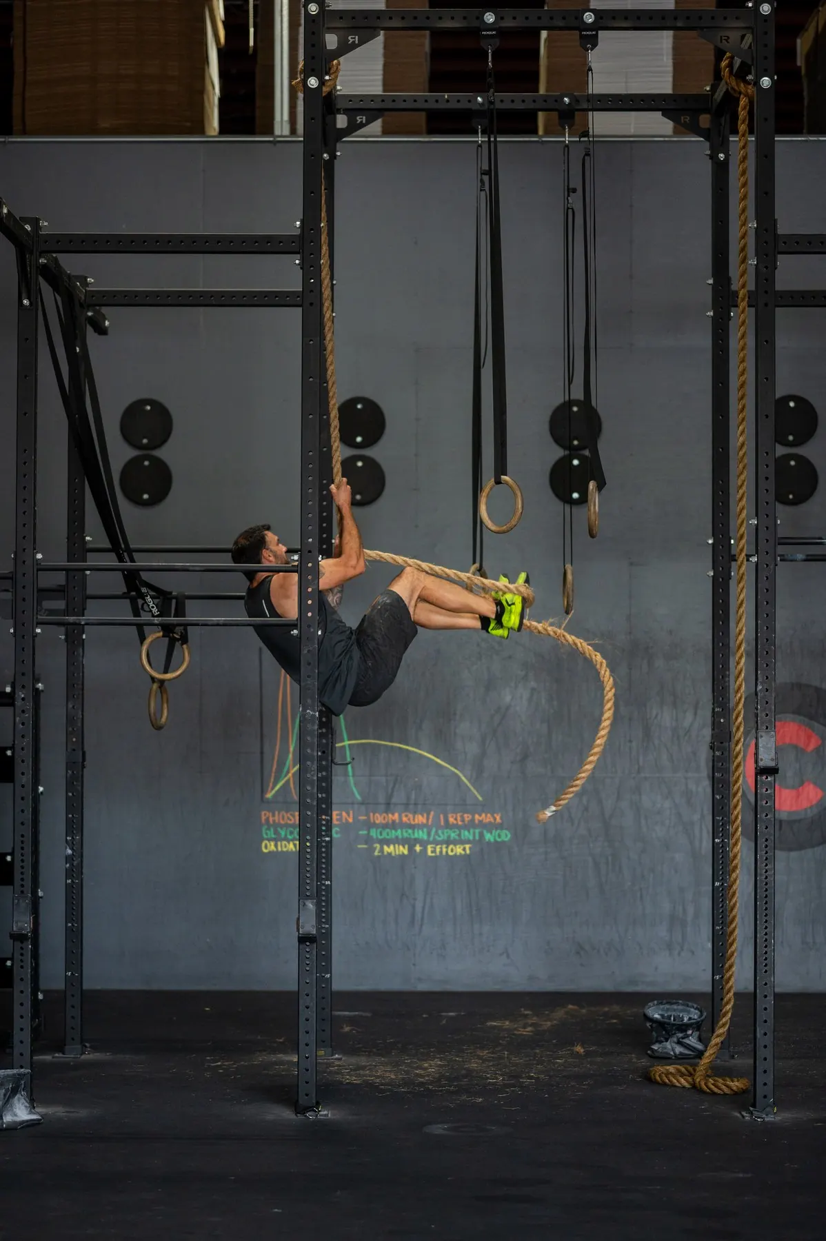 A member climbing the rope on the rig